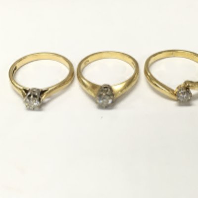Three 18ct gold diamond solitaire rings. Sizes K M and N approximately 9.1g