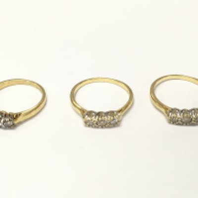 Three 18ct gold diamond three stone rings sizes K and M approximately 7.14g
