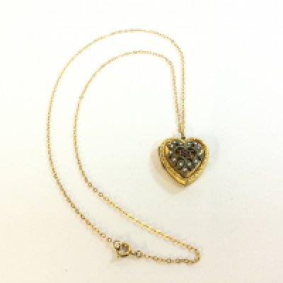 A 9ct back front silver fitting Heart pendant on a 9ct gold chain . 5.8g total weight. Postage category A