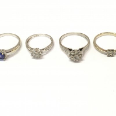 Four 18ct white gold rings with various stones including diamonds. Sizes J L O P approximately 11.1g