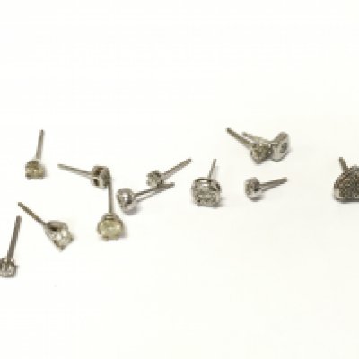 A collective lot of assorted white metal studs with various stones including diamonds. Approximately 5.7g