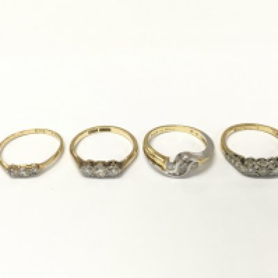 Four 18ct gold diamond three stone rings. Sizes K and K 1/2 approximately 10.4g