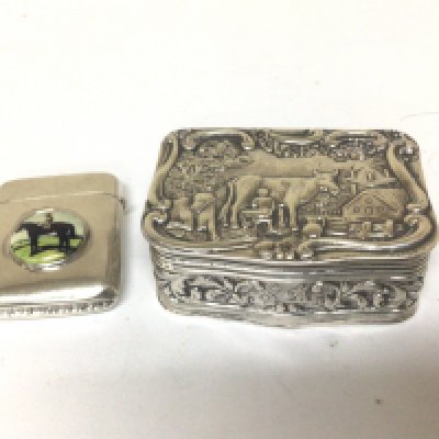 A Continental silver snuff box with Repousse chasing with cattle and rural scene. and a Vesta case with enamel decoration of a race horse (2)