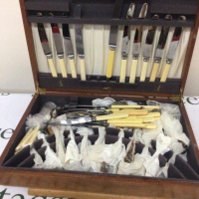 A Maple Wood Canteen of mixed Cutlery in a fitted case.