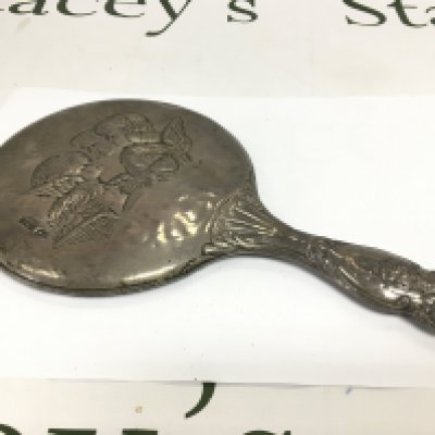 A silver backed hand mirror with cherub decoration, Birmingham hallmarks. Shipping category D.