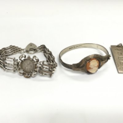 A silver cameo bangle a silver gate bracelet and a silver ingot. Total weight 66.46g