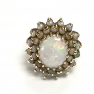 A 9ct gold Opal cluster ring. 6.45g and size M