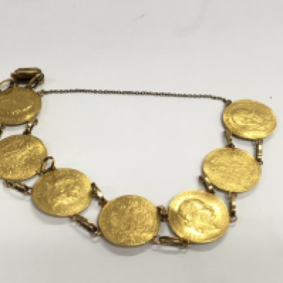 WITHDRAW - A gold bracelet made up of 7 ducat coins with 14ct links. Total weight approximately 30.75g