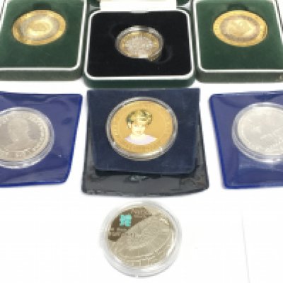 Seven silver proof British commemorative coins. Shipping category A.