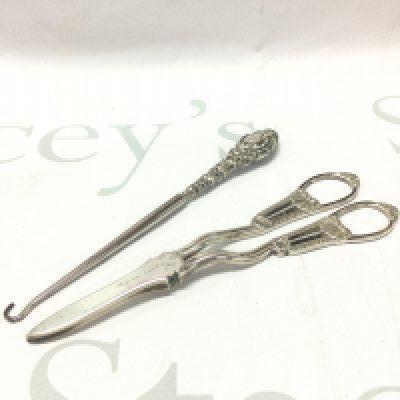 A pair of silver Asprey London grape scissors, silver handled button hook . Postage category B
