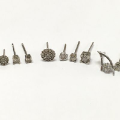 9ct White gold earrings set with Moissanite and diamond stones , no pairs or butterflys . 3.9g total weight, Postage category A