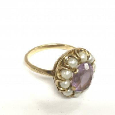 A 9ct gold, amethyst and pearl ring, approx 5g and approx size N. Shipping category A.
