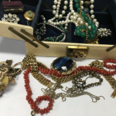 a box containing costume jewellery various .