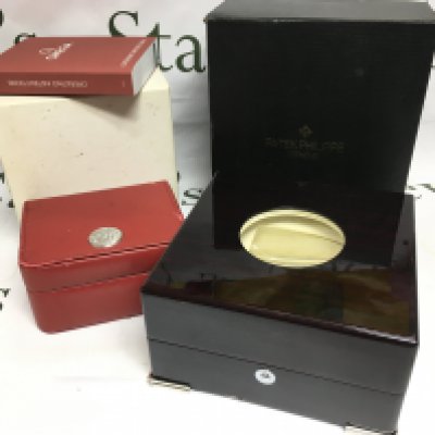 An Omega watch box and instruction booklet together with a Patek Philippe watch box (2). Shipping category B.