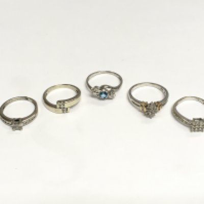Five rings comprising white gold and platinum examples set with diamonds, total approx 12.5g. Shipping category A.