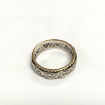 A gold eternity ring, approx 3.8g and approx size L-M. Shipping category A.