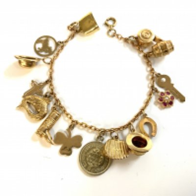 A 9ct gold charm bracelet, various charms.