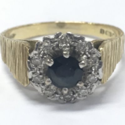 An 18ct gold sapphire and diamond cluster ring . 5.7g total weight. Size R/S. Postage category A