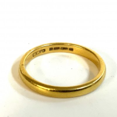 A 22ct gold wedding band.