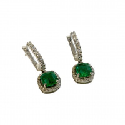 A pair of 18ct white gold and diamond set drop earrings each set with a cushion cut emerald. (A)