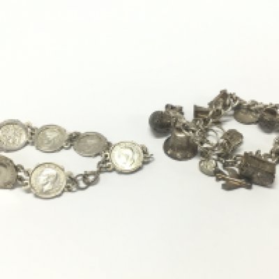 A silver charm bracelet and a silver three pence bracelet. Approximately 70.9g total weight. Postage category A