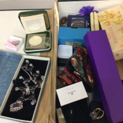 A box containing a quantity of costume jewellery including silver jewellery coins and other oddments.