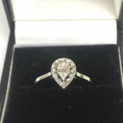 A 14ct white gold diamond cluster ring, approx 1.8g and approx size N. Shipping category A.