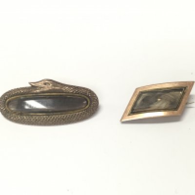 Two quality unmarked yellow metal mourning brooches.