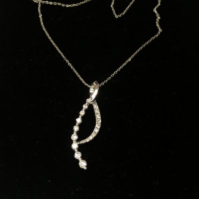 A 14ct white gold diamond necklace. Approximately 3.77g