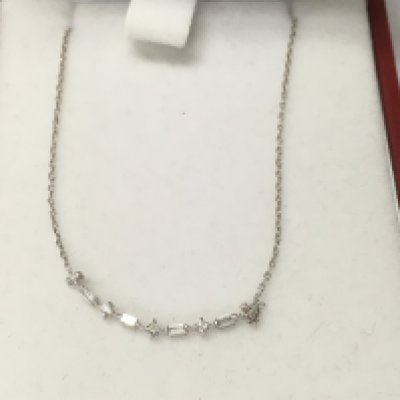 A 14ct white gold row diamond necklace.