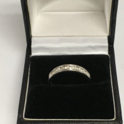 A 9ct white gold diamond eternity ring, approx 2.4g and approx size N-O. Shipping category A.