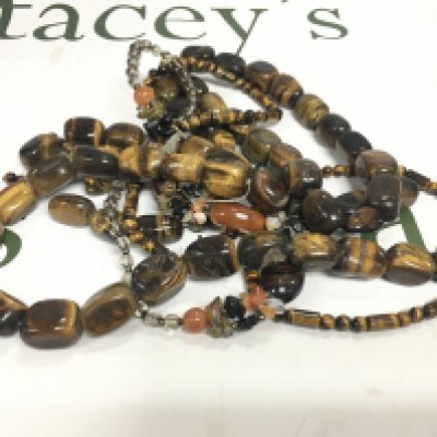 A collection of tigers eye beaded jewellery.
