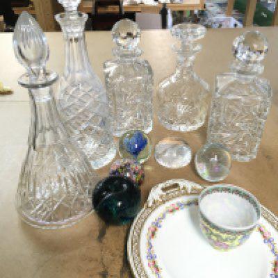 A collection of cut glass decanters, paperweights, a modern Chinese small vase and a ceramic dish. This lot cannot be posted