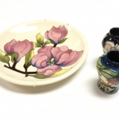 A Moorcroft Magnolia plate and two small vases. This lot cannot be posted.