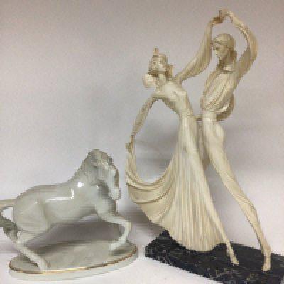 A ceramic model of a white horse and a resin figure group of a dancing couple on a marble base. Hight 50cm (2)