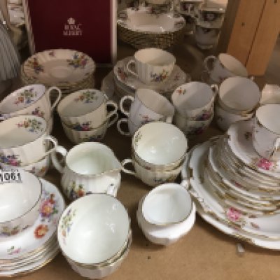 Three part tea sets including Royal Crown Derby, Royal Worcester- decorated with flowers and foliage
