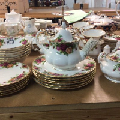 A Royal Albert old English Country Rose tea and dinner set comprising cups sauces small tea pot graduating plates dessert bowls no obvious damage.