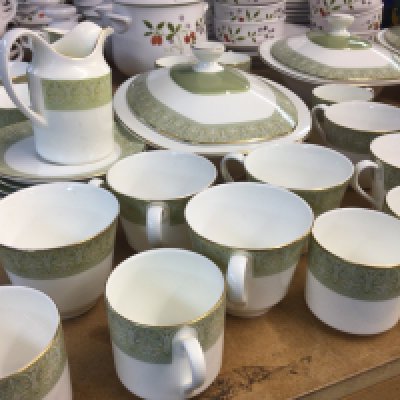 A Royal Doulton Sonnet pattern extensive porcelain dinner service with tea and coffee cups and saucers graduating plates tureens dessert bowls and more no obvious damage.