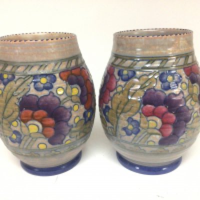 A pair of Charlotte Rheed ceramic vases hand decorated with a floral pattern. No obvious damage or restoration. Hight 18cm (2)