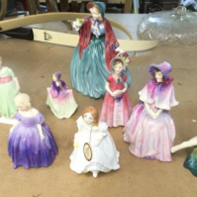 A collection of eight Royal Doulton figurines.
