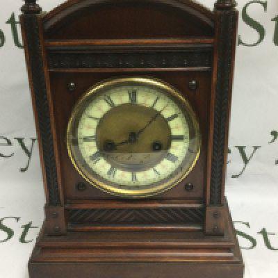 A mahogany cased eight day mantle clock. Shipping category D.