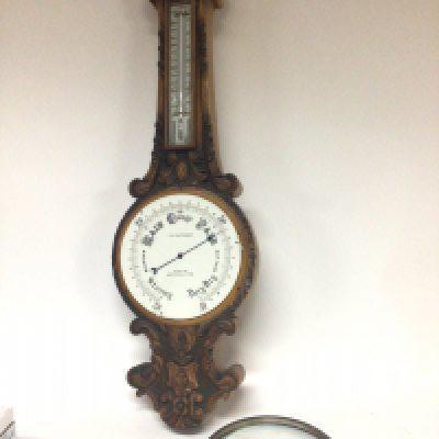 A carved oak barometer for restoration. The dial with inscriptions TB winter & Son. Hight 89cm