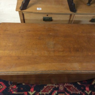 A table with drop sides and barley legs.