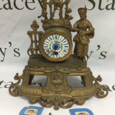 A French gilt mantle clock with painted enamel dial and further painted enamel panels, in need of attention. Approx height 34cm. Shipping category D.