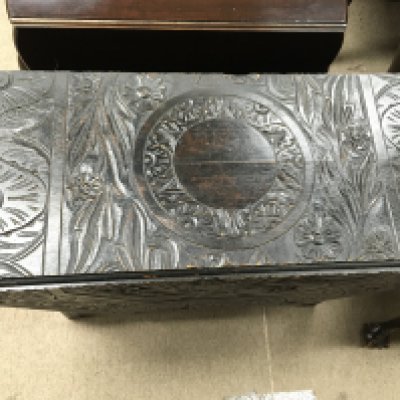 A carved oak drop leaf table. 90 cm wide. No reserve