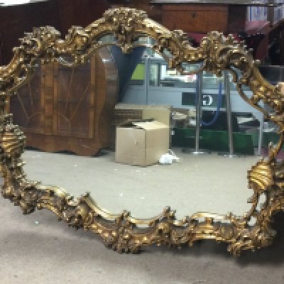 A wide composition gilt mirror 160cm wide 106cm tall. This lot cannot be posted