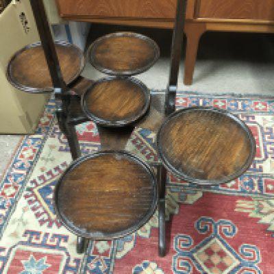 A oak five tier cake stand .