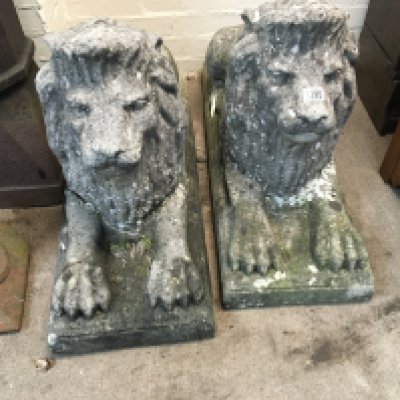 A pair of composition lions A /f .