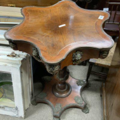 A French Louis XVI pedestal table quarter mahogany veneered with brass fittings.