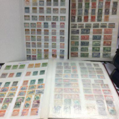 Seven albums of world stamps. Shipping category D.